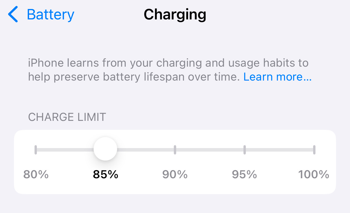 A charging screen displays that an iPhone's charge limit is set to 85%, with an explanation about optimizing battery lifespan.