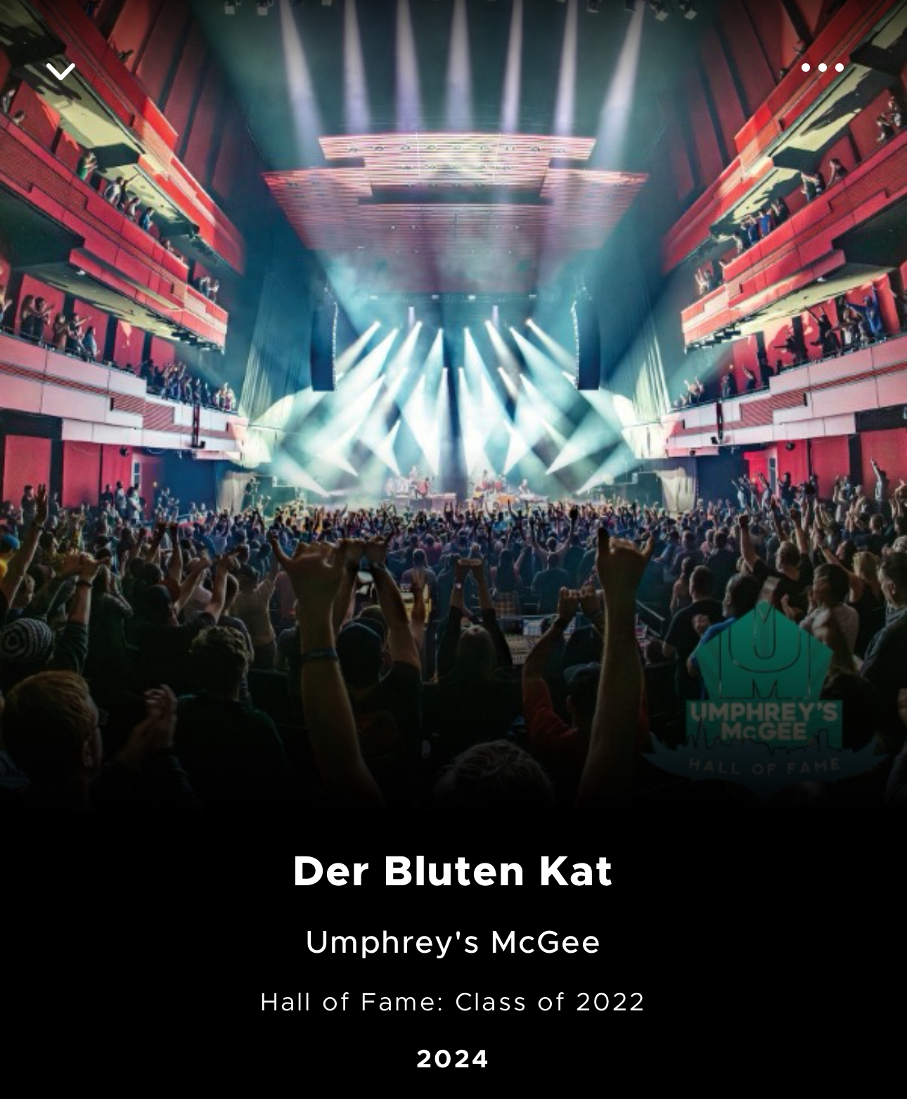 Concert scene with audience raising hands towards a brightly lit stage, with the text “Der Bluten Kat, Umphrey’s McGee, Hall of Fame: Class of 2022, 2024” indicating the band and album details.