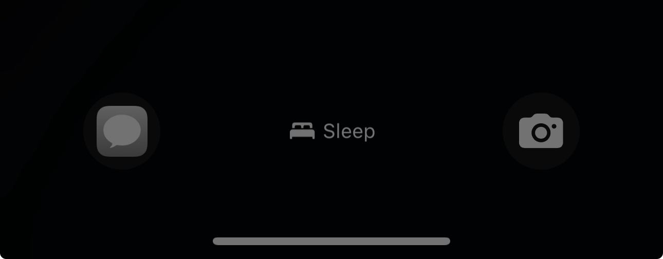 This image displays a dark screen with three icons: a speech bubble icon on the left, a bed icon labeled “Sleep” in the center, and a camera icon on the right.