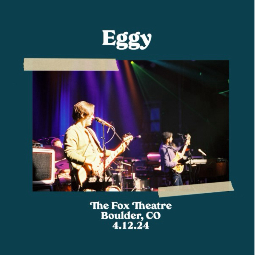 Concert poster of the band Eggy performing at The Fox Theatre in Boulder, Colorado, on April 12, 2024. Features a photograph of band members playing on stage with colorful stage lighting.