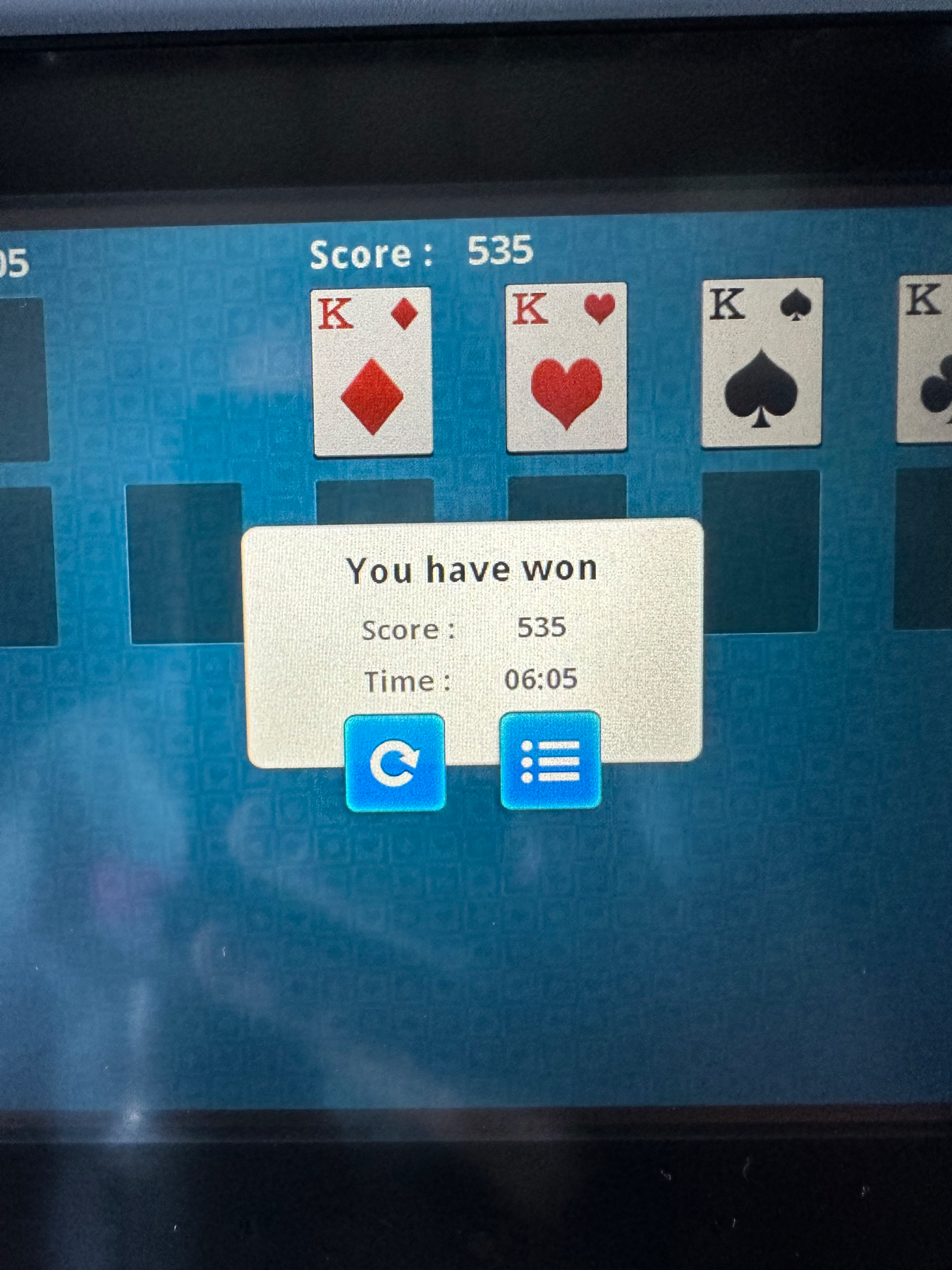 A computer screen displaying a completed game of Solitaire, with a pop-up window stating “You have won” and showing a score of 535 and a time of 6:05. The four King cards are visible at the top of the game