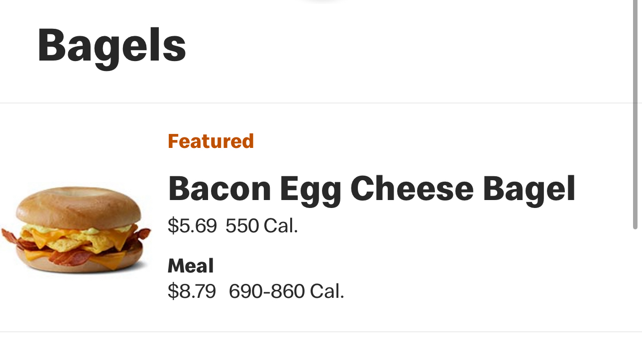 The image shows a menu selection with the title “Bagels” and features a “Bacon Egg Cheese Bagel” priced at $5.69 with 550 calories. Below it, a meal option is priced at $8.79 with 