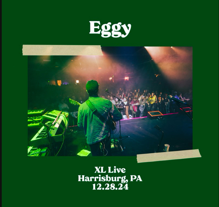 A musician on stage is performing at XL Live in Harrisburg, PA, with a crowd in the background, scheduled for December 28, 2024, as shown in a promotional graphic for a band called Eggy.