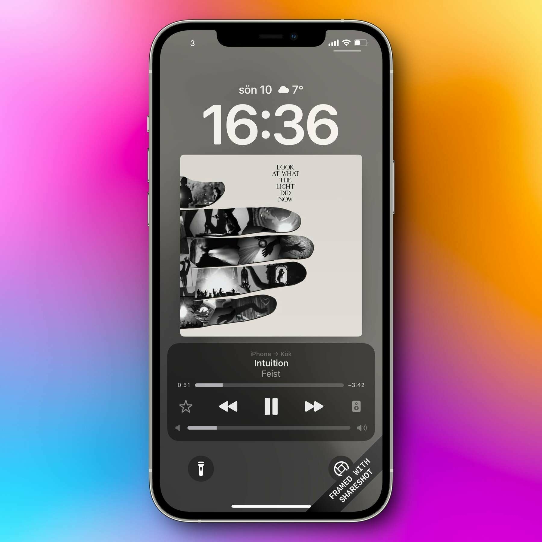 Auto-generated description: A smartphone screen displays a music player showing the song Intuition by Feist with a colorful background.