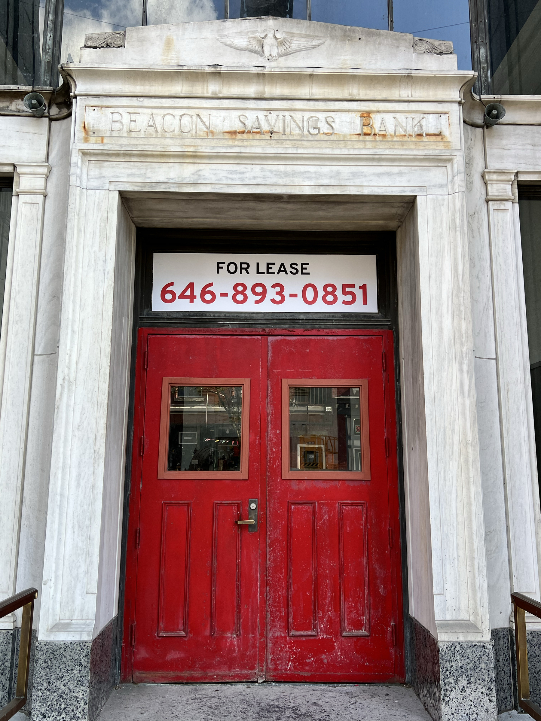 Red door at Beacon Savings Bank building in Beacon, NY