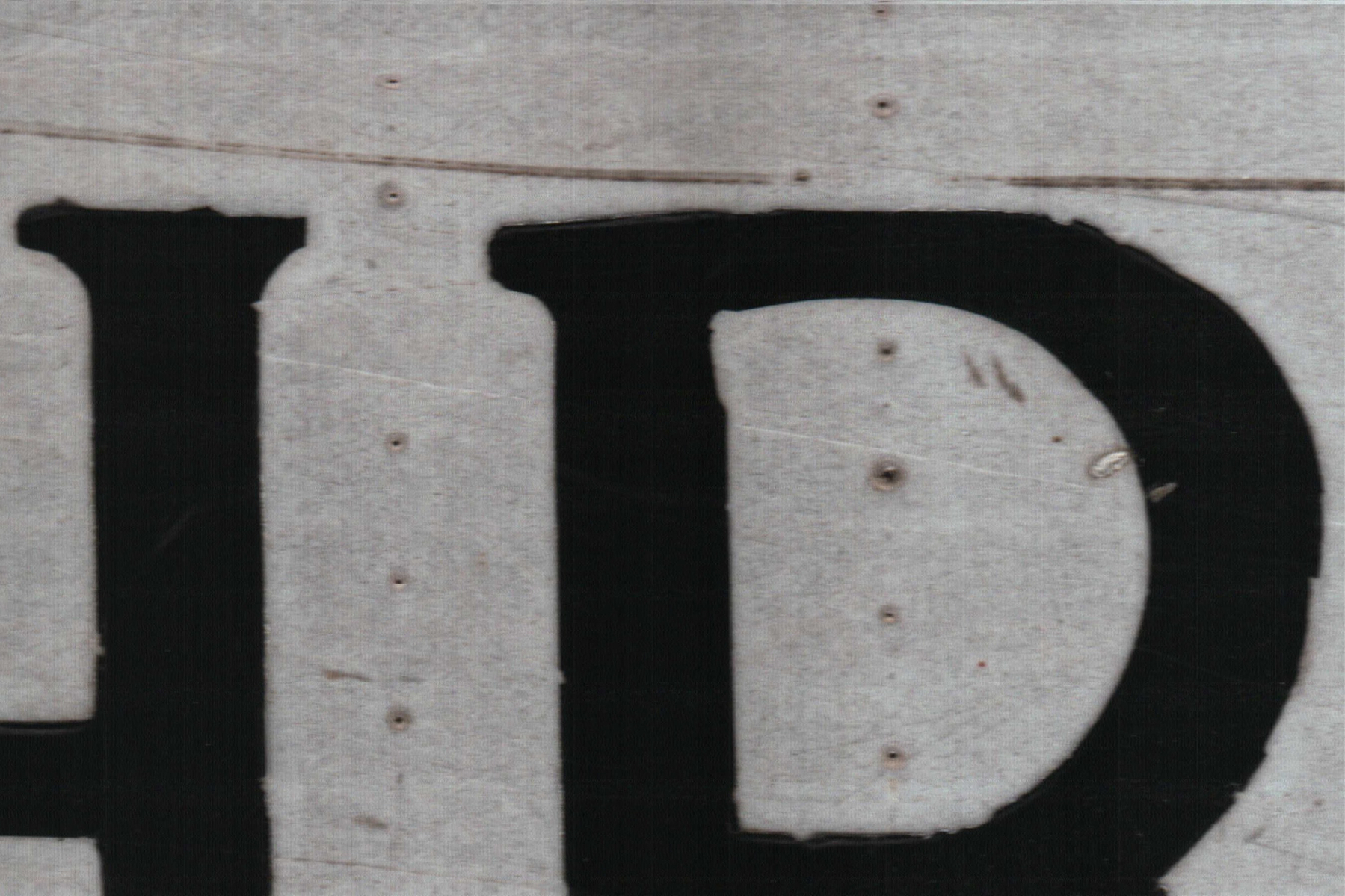Some lettering from a road sign