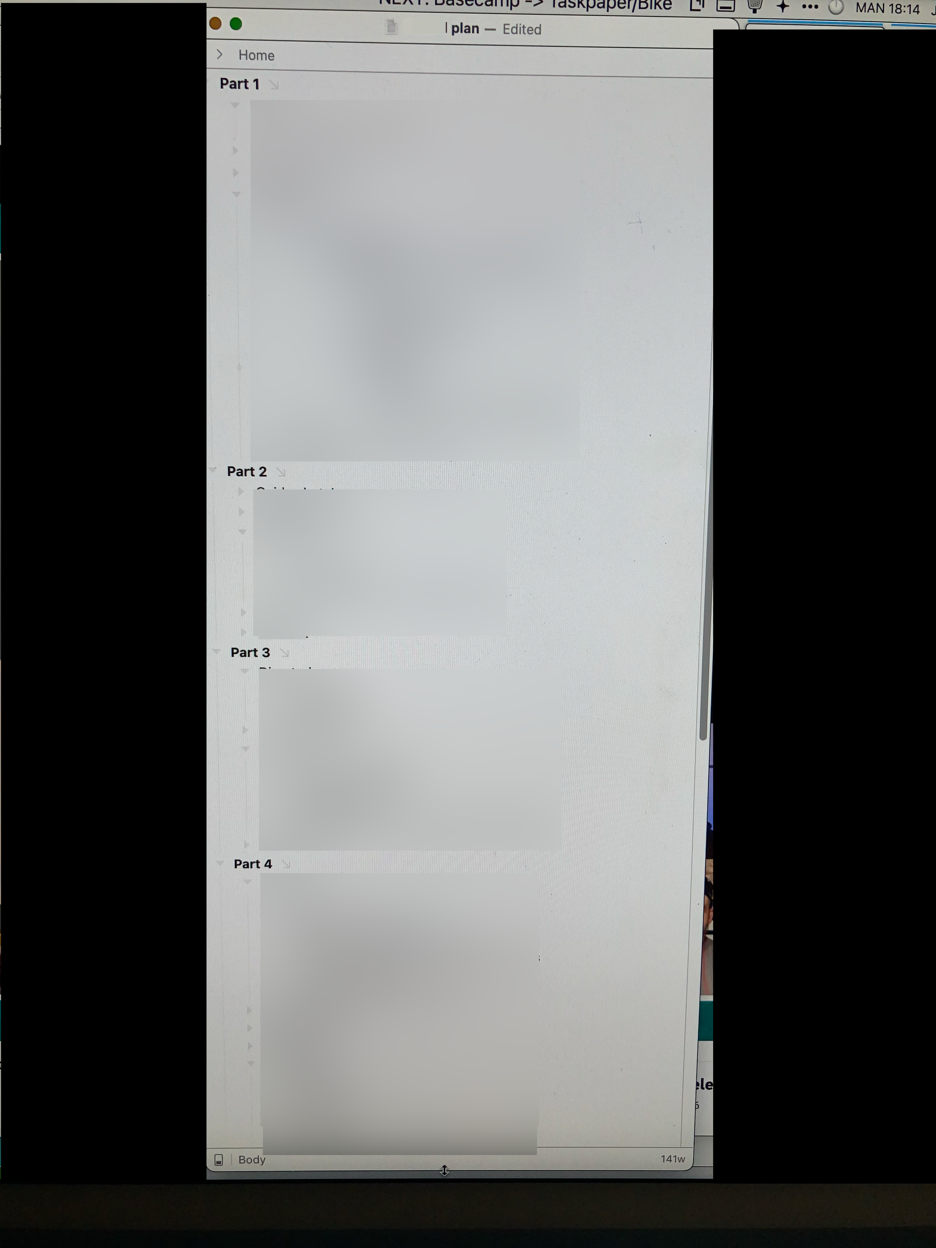 A computer screen, showing almost no detail from an outline document as well as blacked-out sections to avoid sharing non-relevant images.