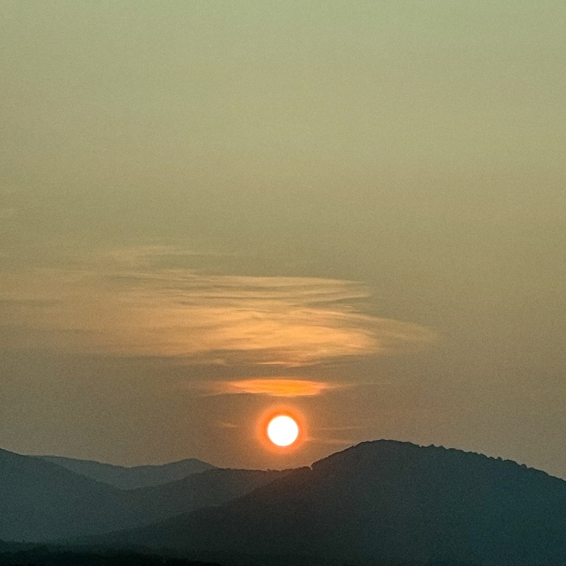 Sun setting behind some mountains in Asheville, NC. 