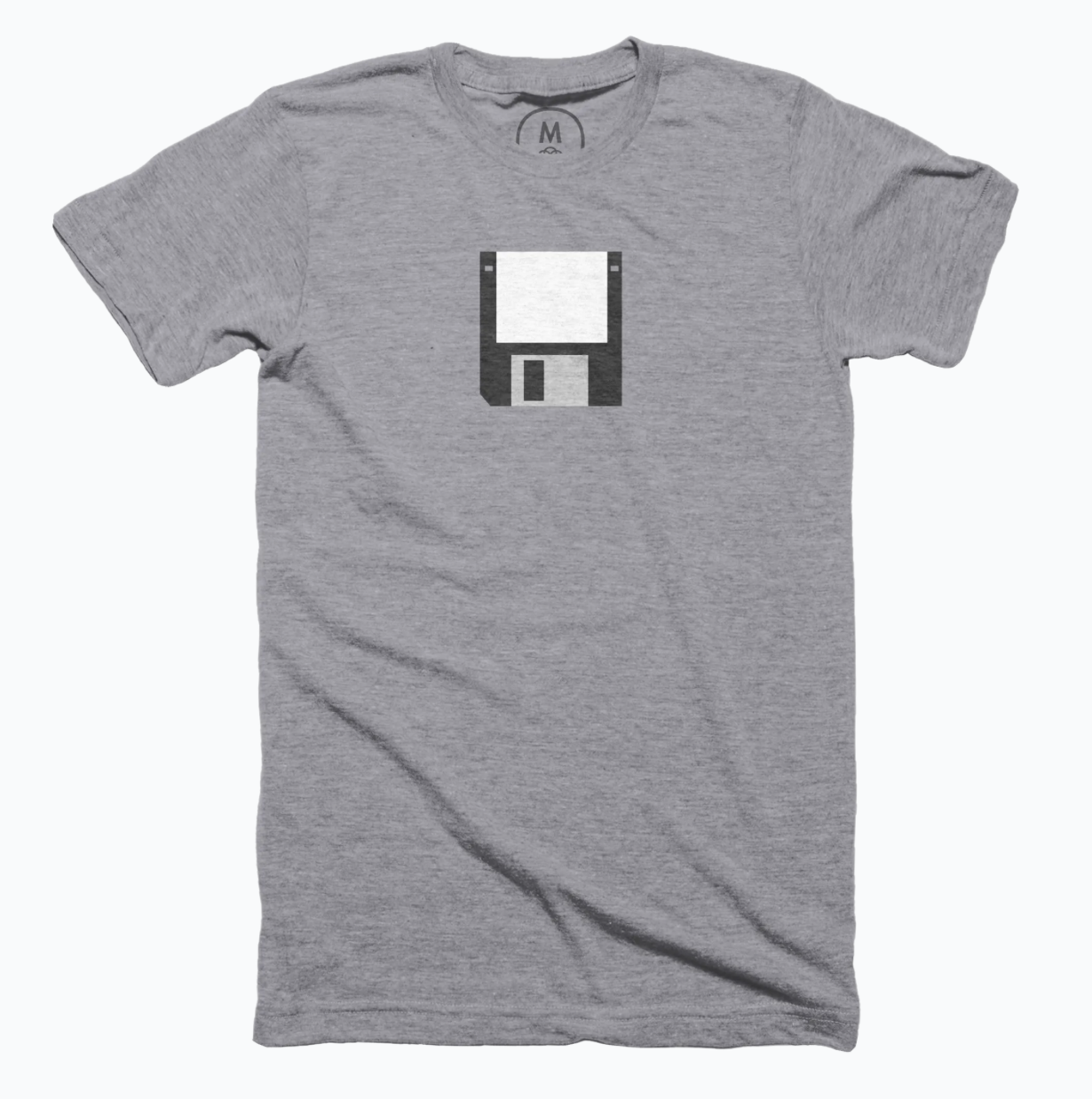 Grey shirt with a black 3.5 inch floppy disk.