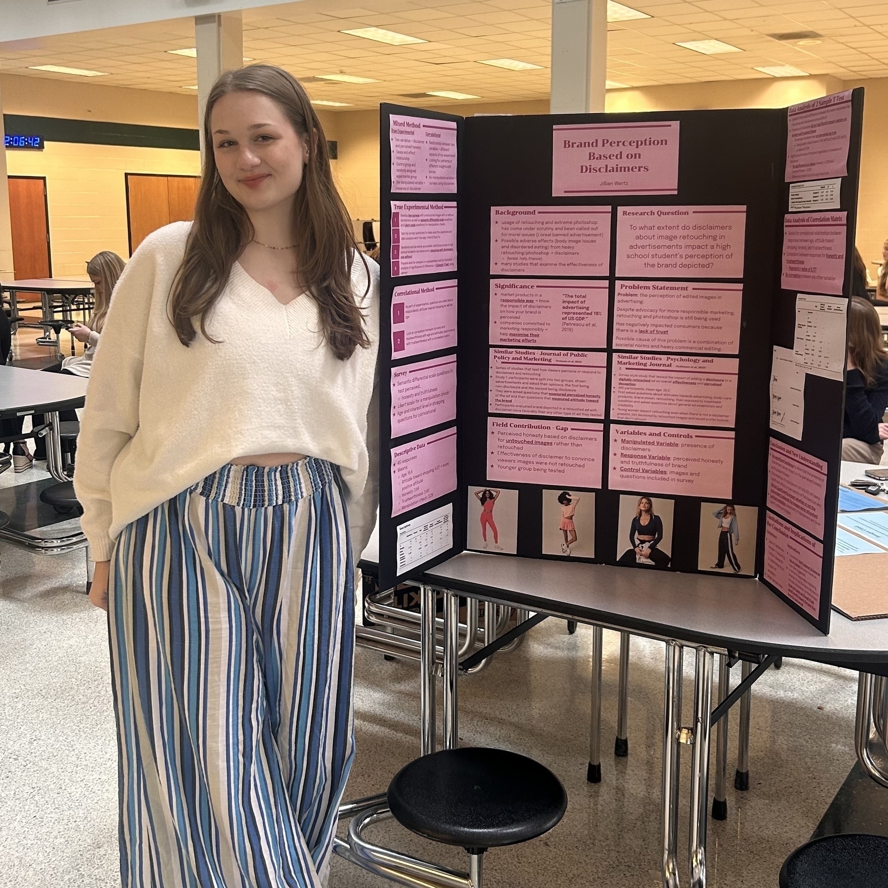 Jill posing with her science fair board. 