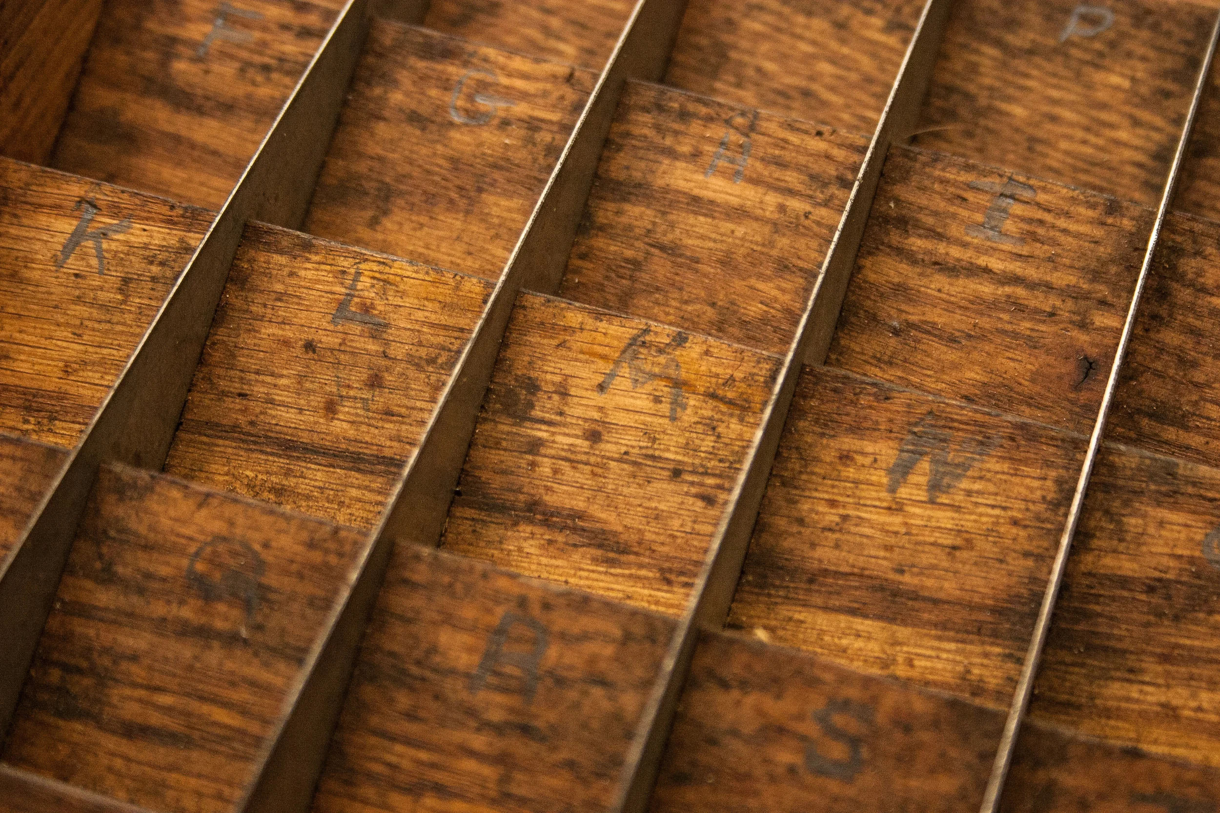 You can still see the pencil marks denoting where the individual letters should go.