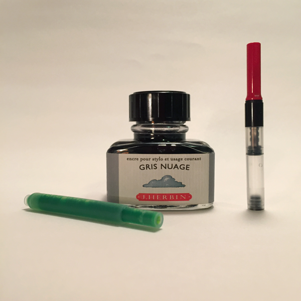 Many beginner pens use Ink cartridges, like the green one above. A bottle of ink can be used with a converter, far right, to use bottled inks with cartridge pens.