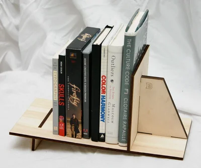 My bookshelf, assembled, with an assortment of books and DVDs.