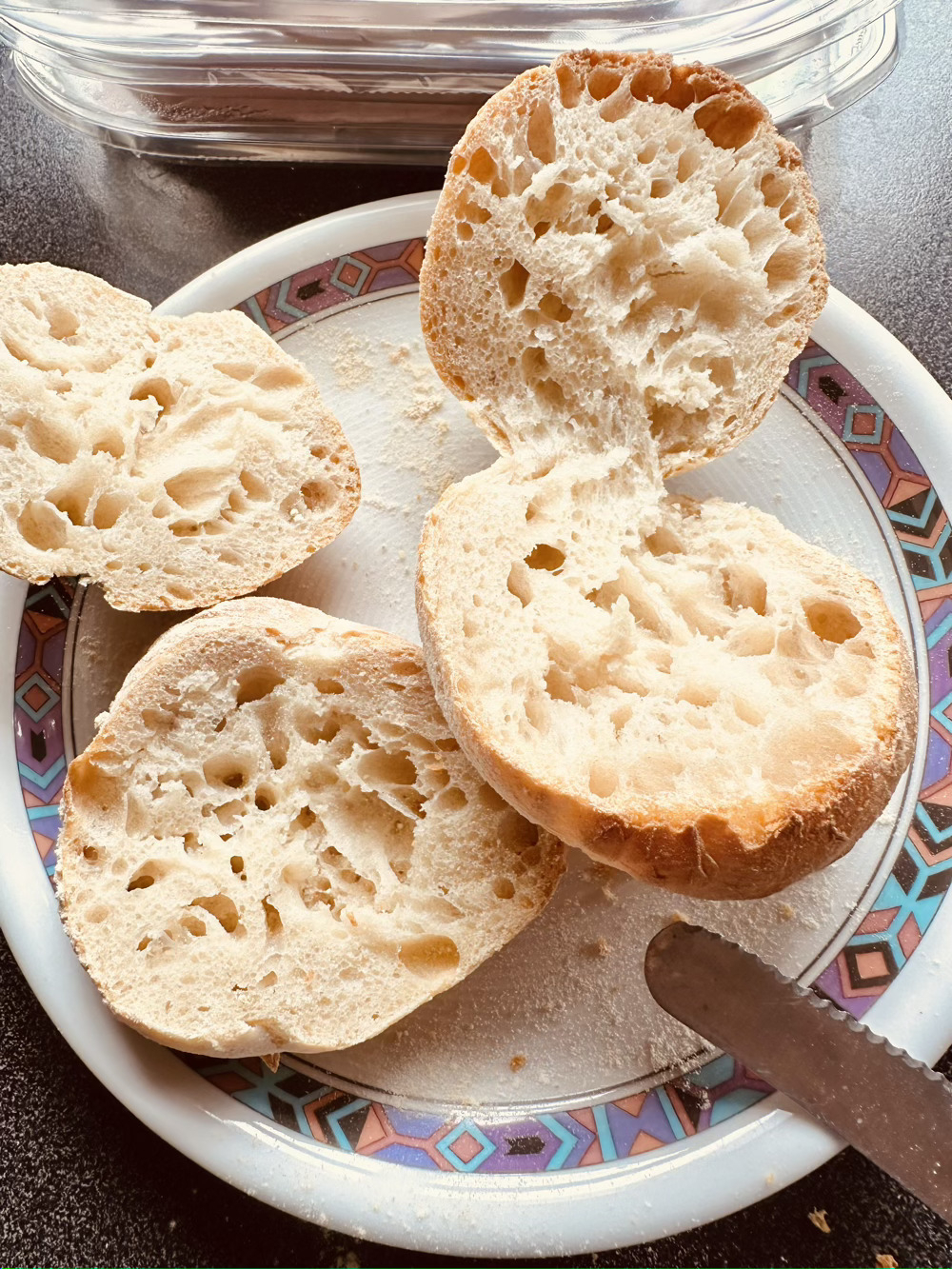 2 bread rolls, cut open, to reveal their holey crumb