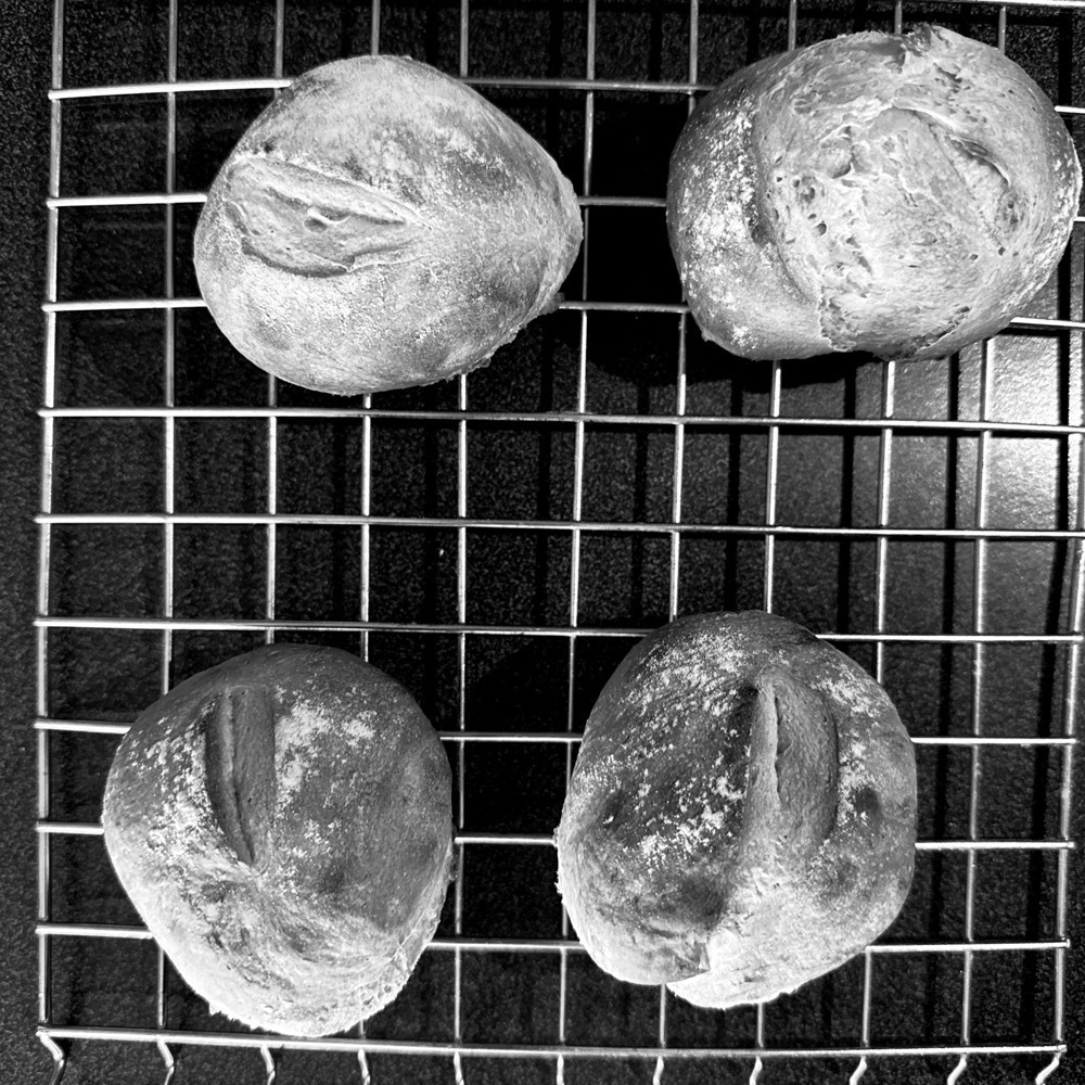 4 bread rolls on the cooling rack