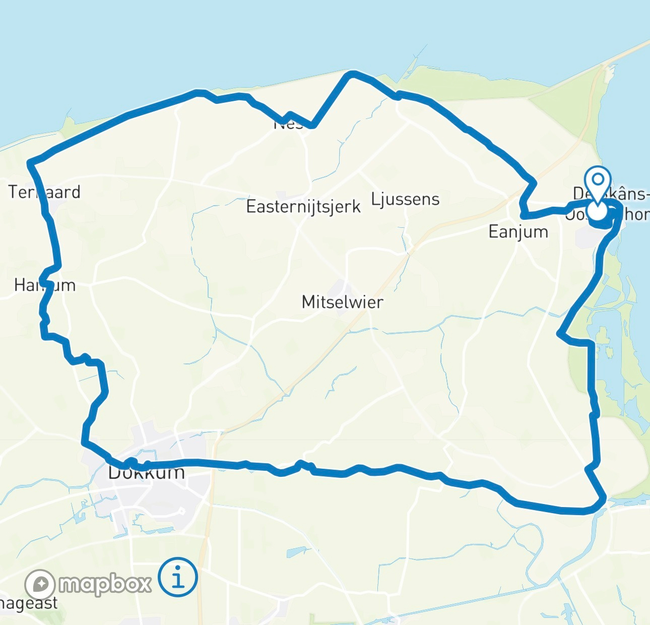 A route outlining a loop through several towns including Dokkum, Ternaard, and Eanjum in a northern region near the coast is depicted.