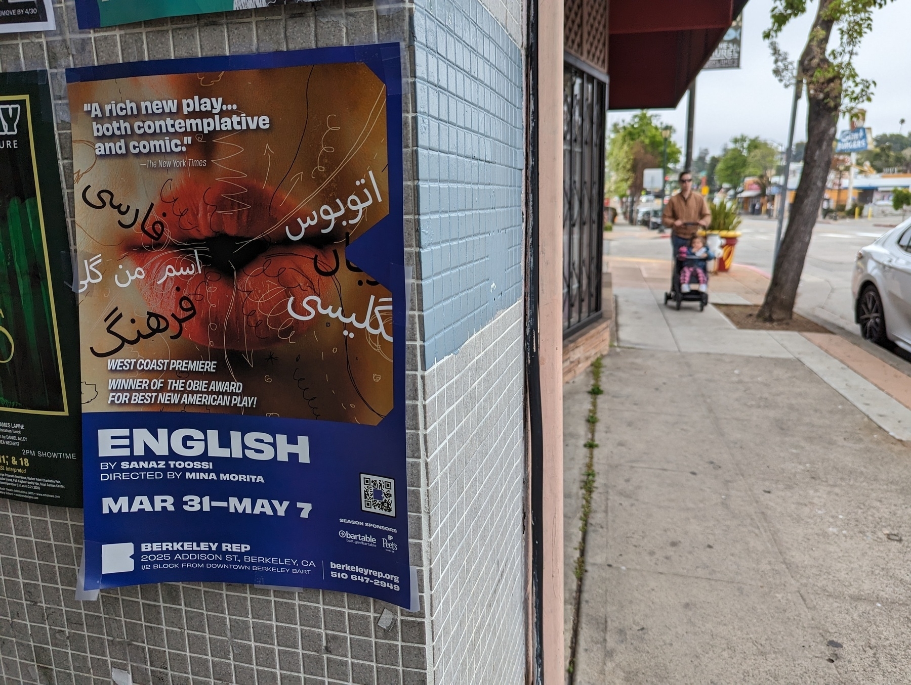 A poster pinned to a wall along MacArthur Boulevard Sunday, April 23 2023 advertises a play at the Berkeley Repertory Theater called "English" by playwright Sanaz Toossi.