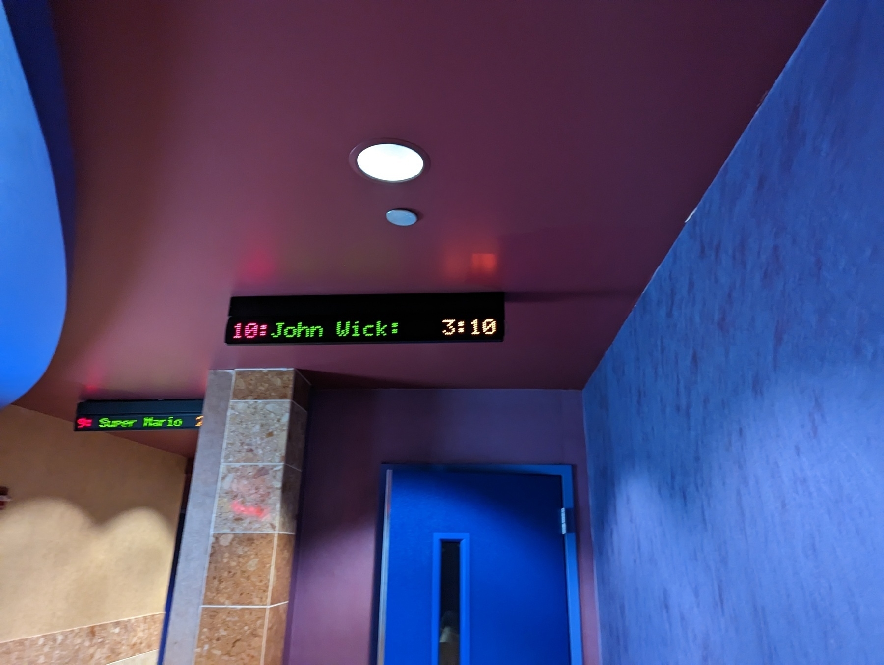 A red lot sign outside a multiplex theater door Sunday, April 9th 2023 in Richmond, California advertises "John wick: Chapter 4" 