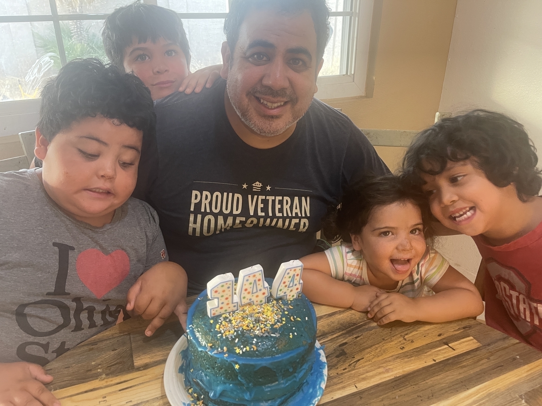 Portrait of author with his four kids and a birthday cake.