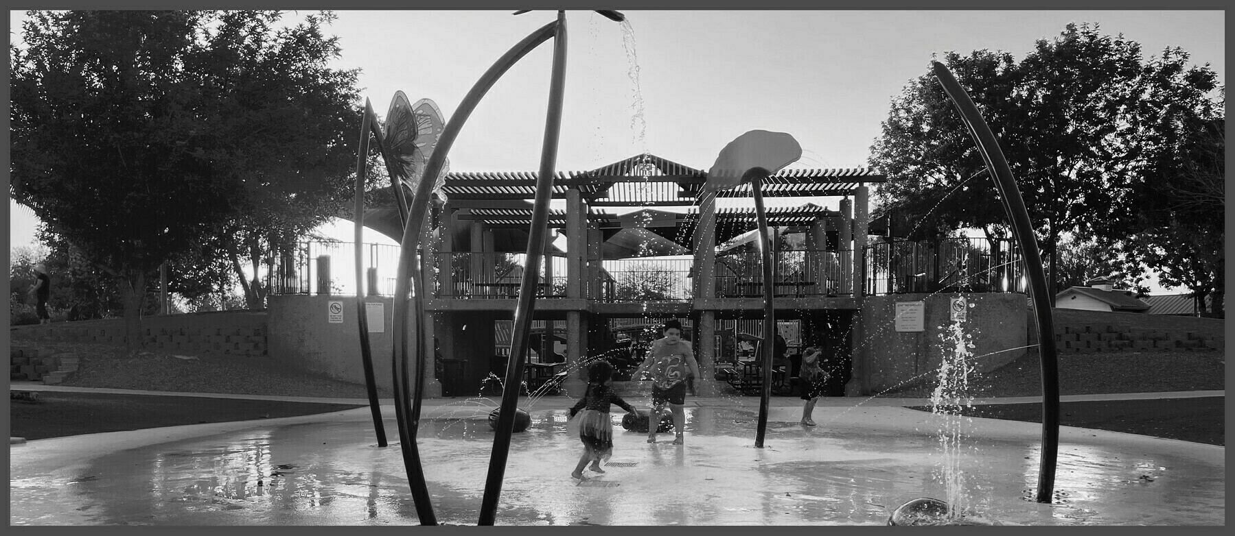 Wide angle crop of children playing in a splash pad