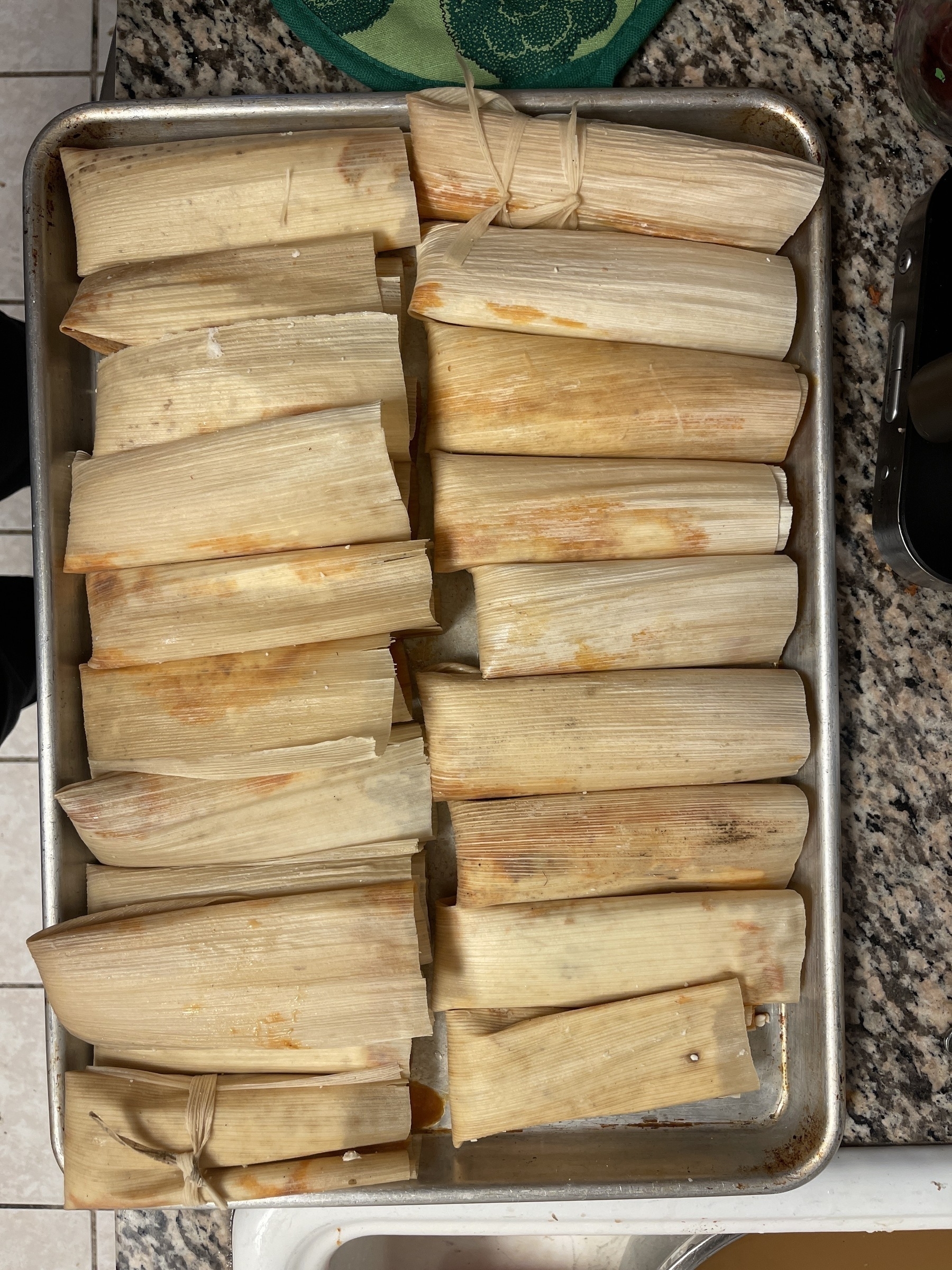 Baking sheet full of tamales