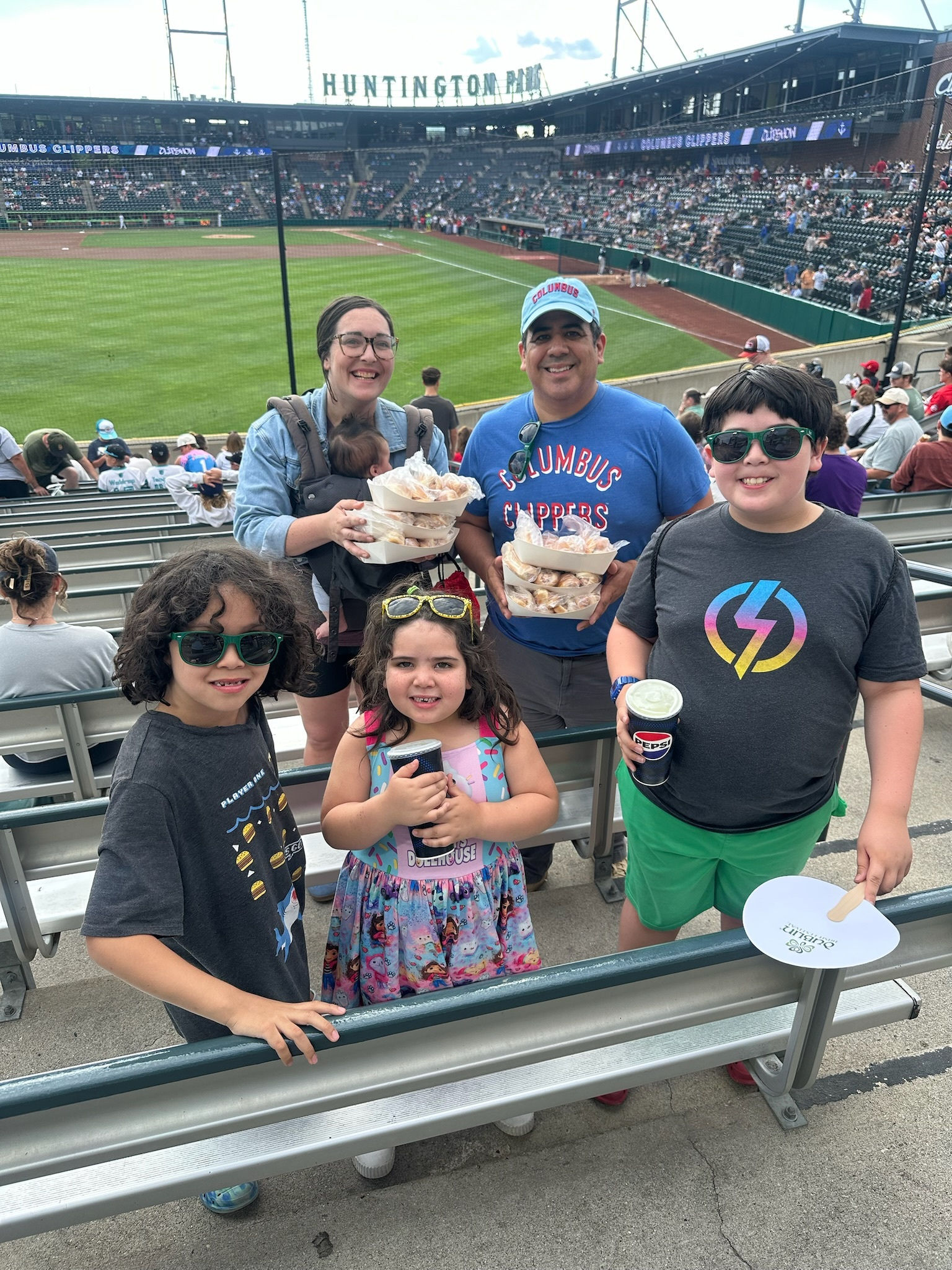 family photo at minor league baseball game