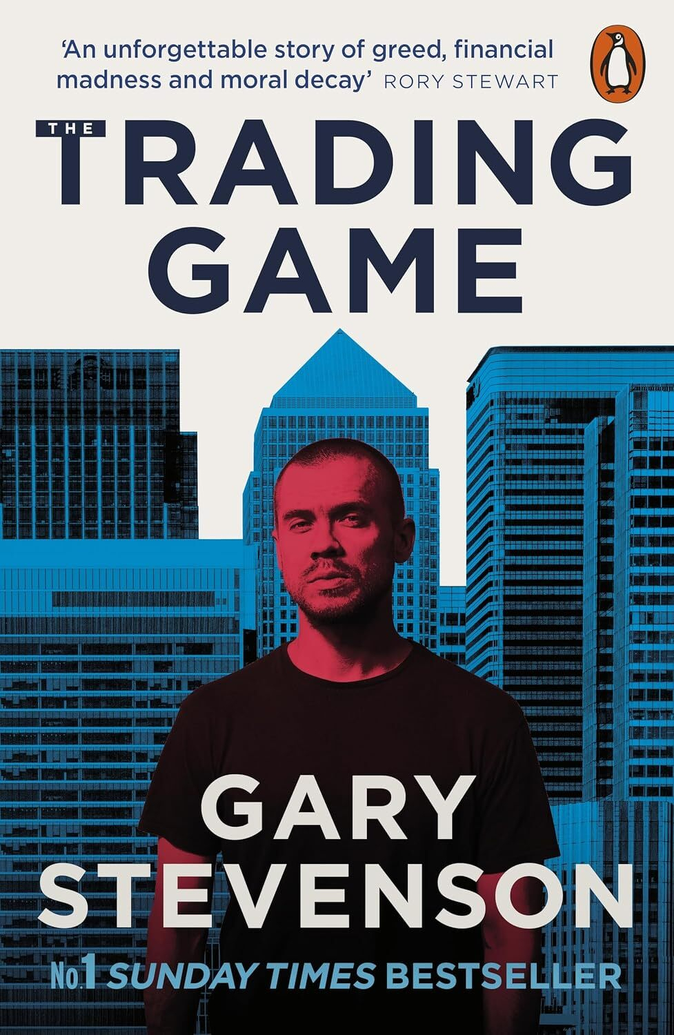 Gary Stevenson stands in front of a stylized skyline on the cover of the book The Trading Game by Gary Stevenson.
