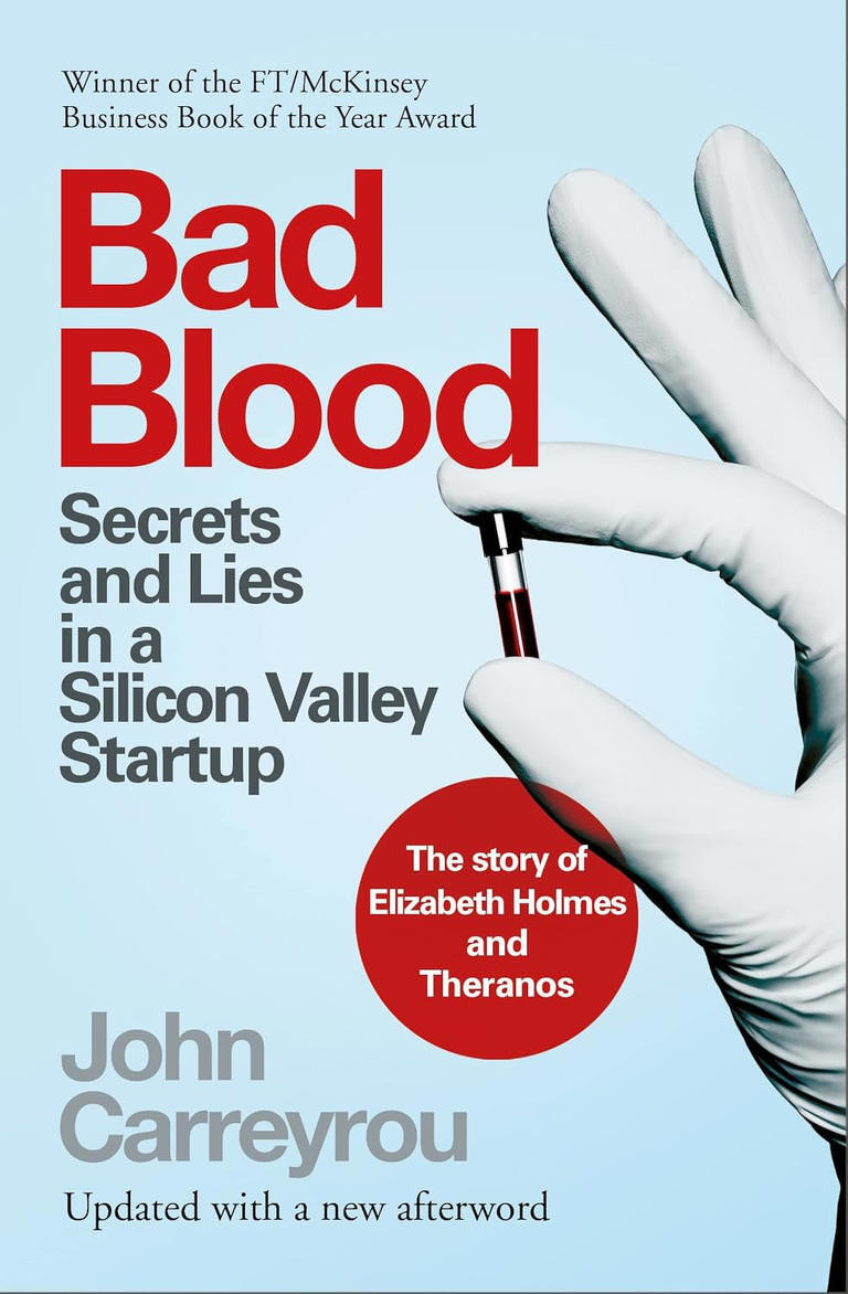 Auto-generated description: Bad Blood by John Carreyrou explores the secrets and lies surrounding the Silicon Valley startup Theranos and its founder Elizabeth Holmes.