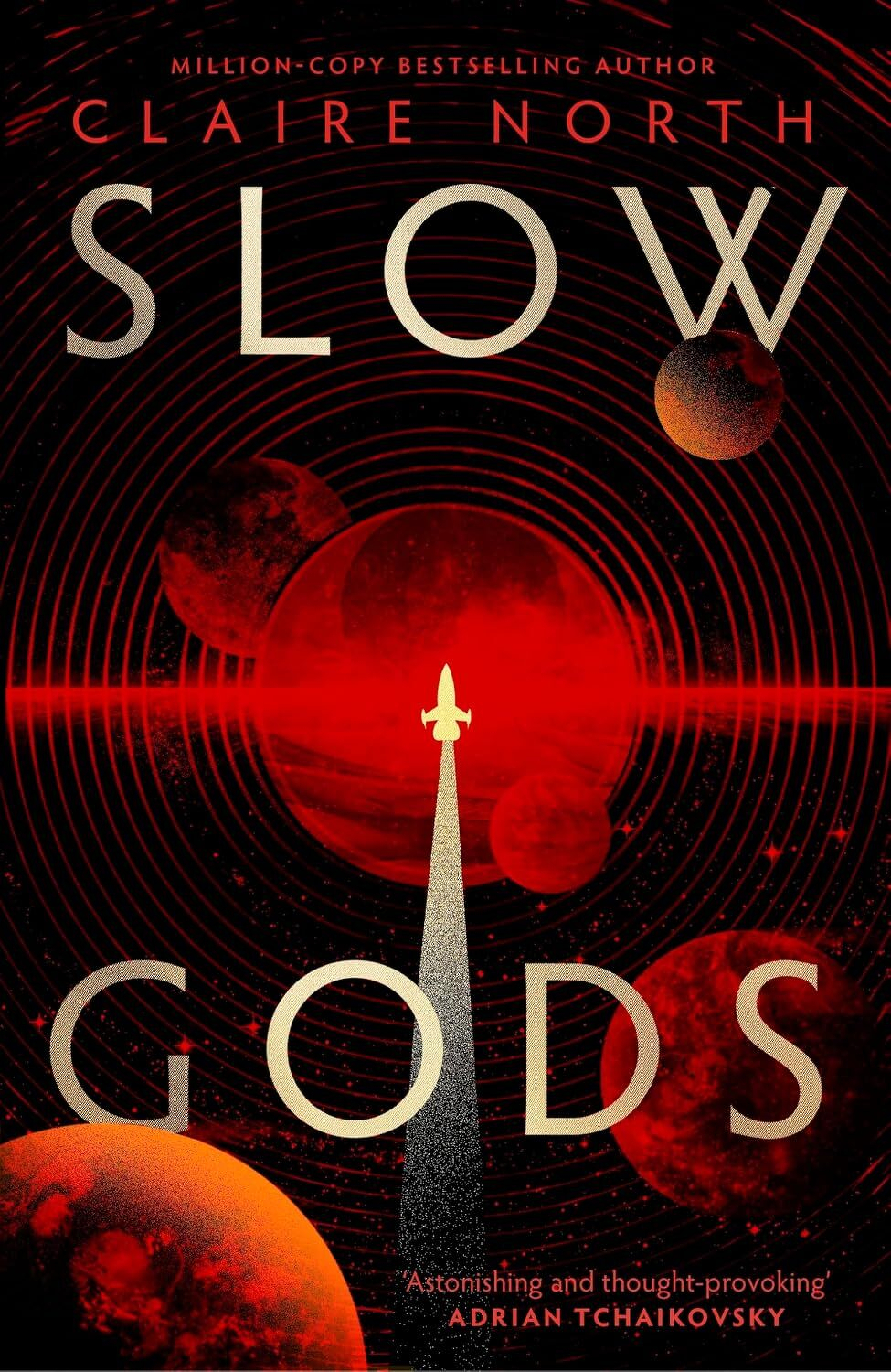 A book cover with a spaceship depicted against a red cosmic background with planets and concentric circular patterns, featuring the title Slow Gods by Claire North.