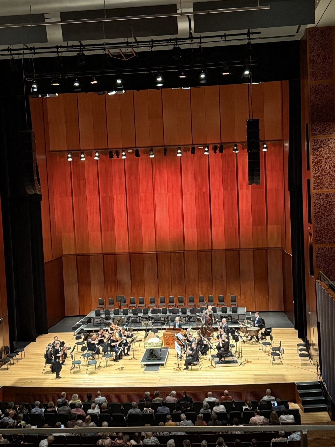 The Queensland Conservatorium Theatre stage with the Queensland Symphony Orchestra assembling.