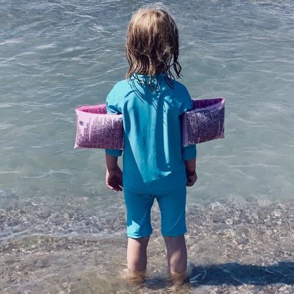 Girl facing the ocean