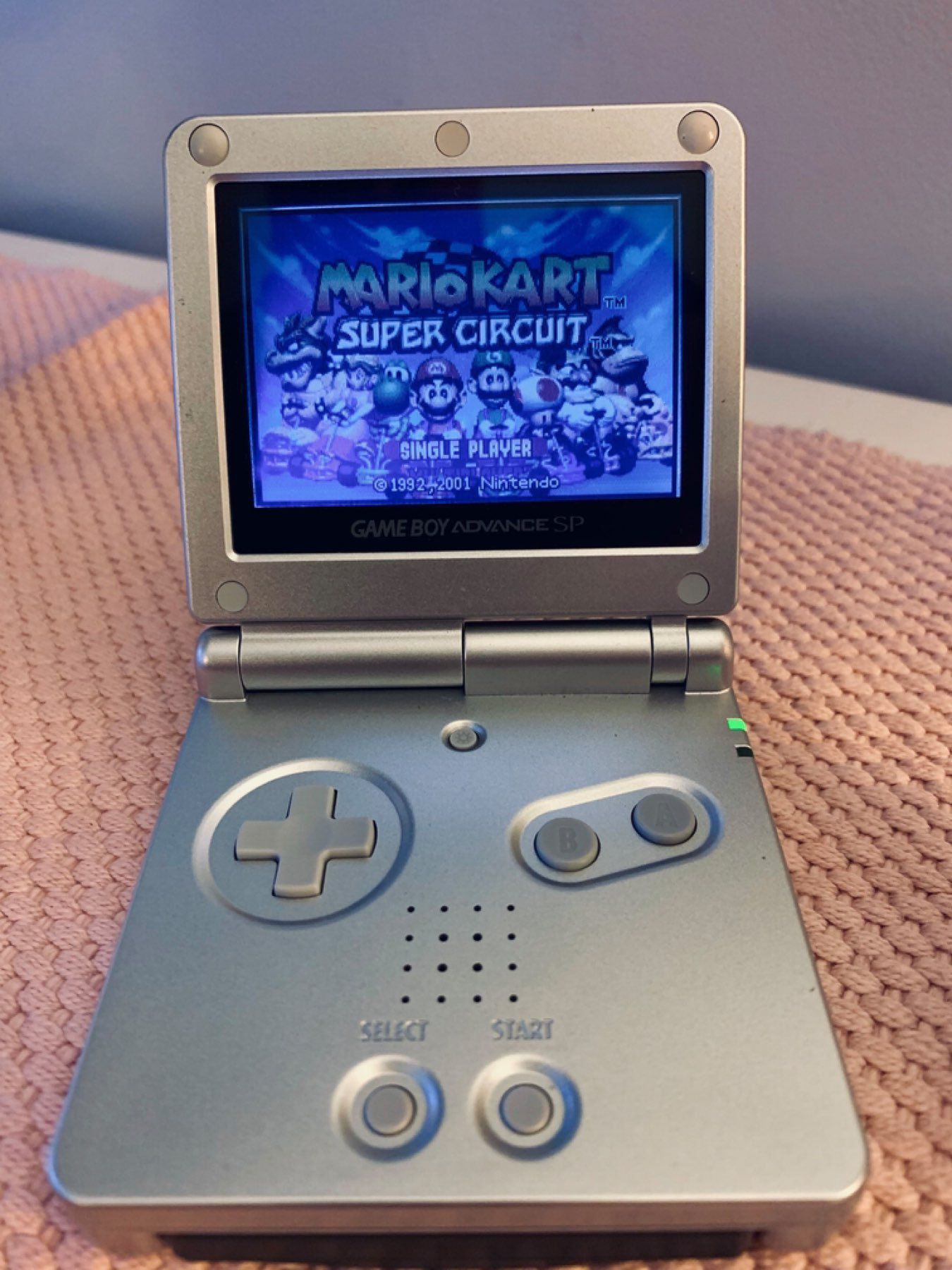 Nintendo Gameboy Advance SP. Mario Kart Super Circuit on screen.
