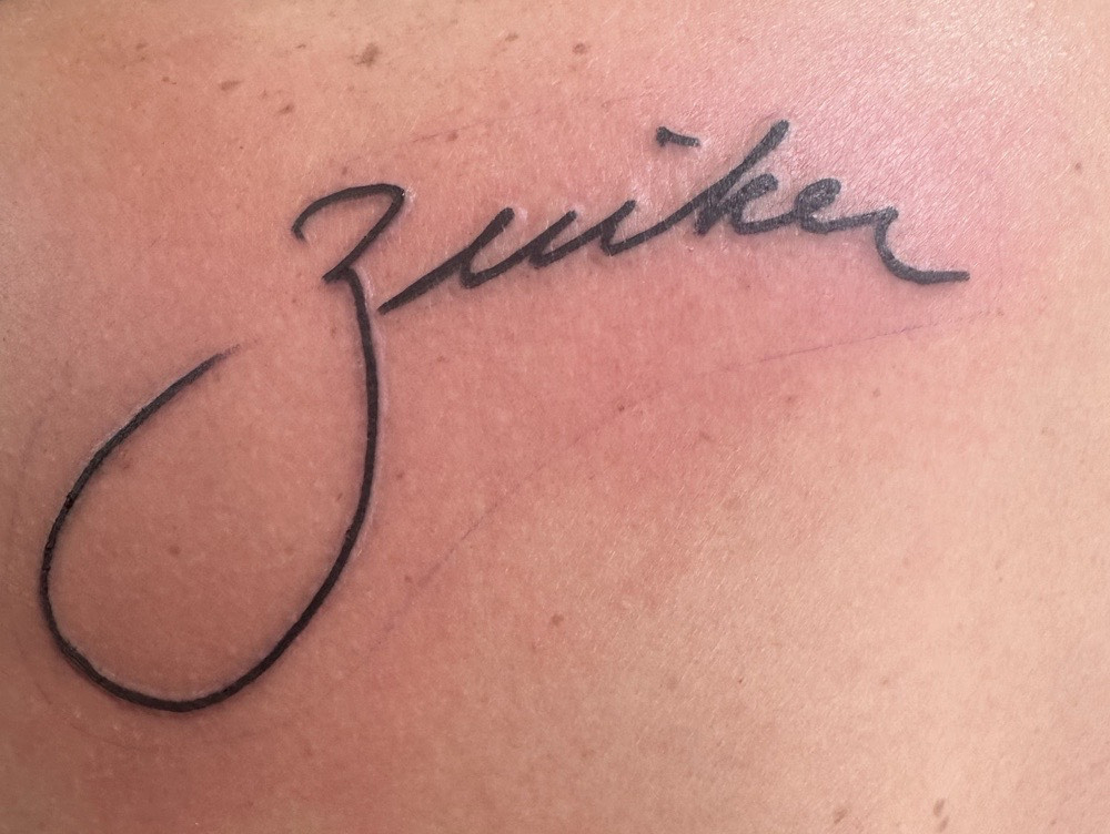 a Zuiker tattoo based on his grandfather's signature.