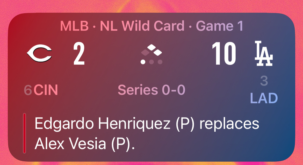 An MLB NL Wild Card Game 1 scoreboard shows the Dodgers leading the Reds 10-2 with a pitching change for the Reds.