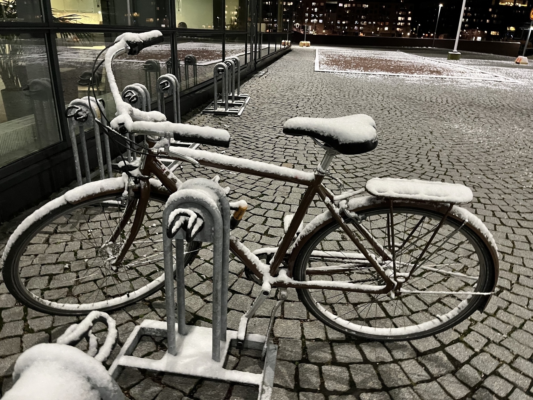 A bicycle with snow on it