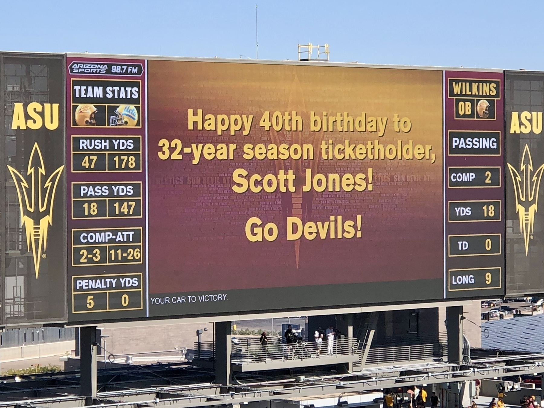 Stadium scoreboard reads “Happy 40th birthday to 32-year season ticket holder Scott Jones! Go Devils!”