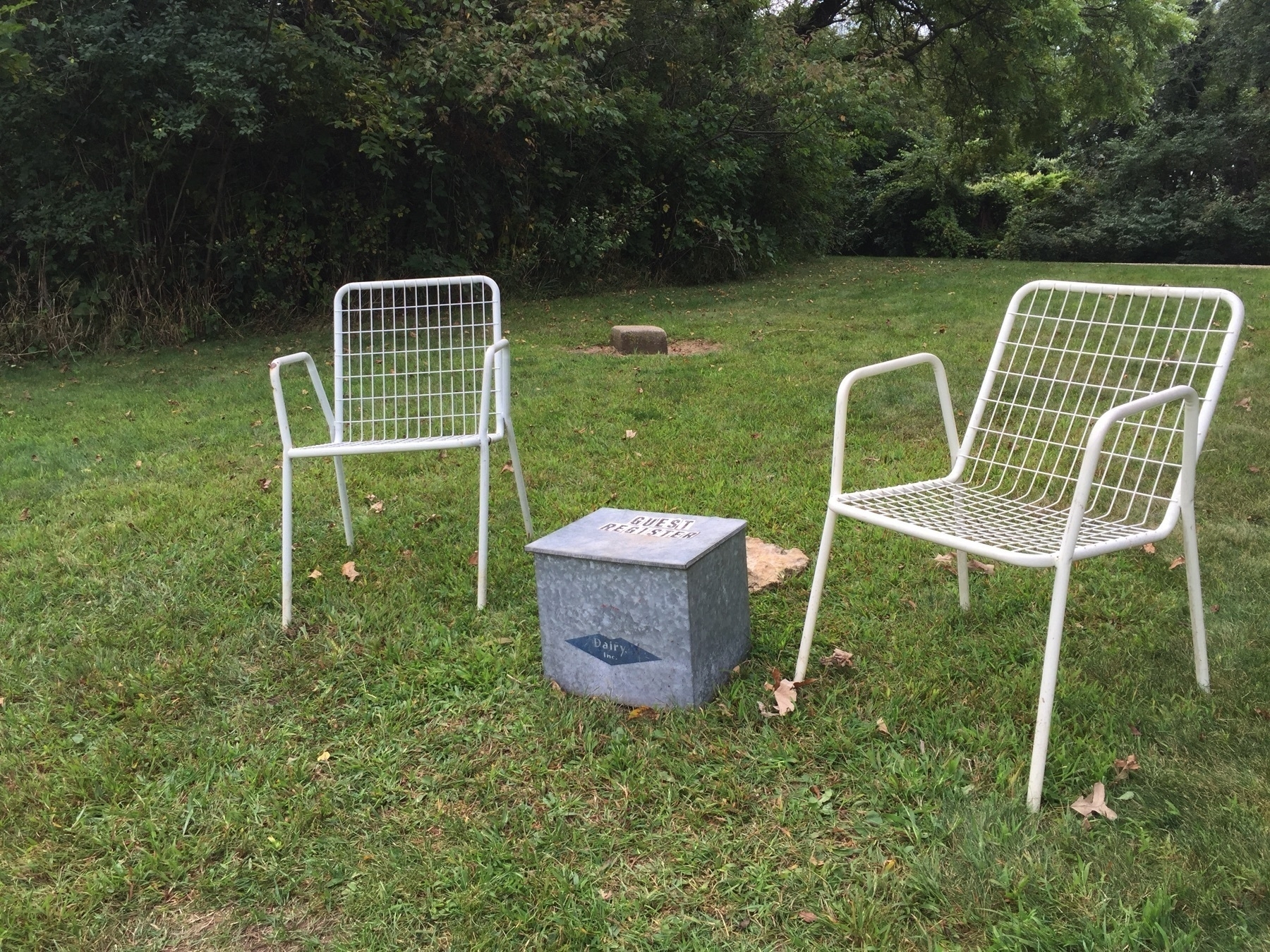 Two cheap lawn chairs and a registry box