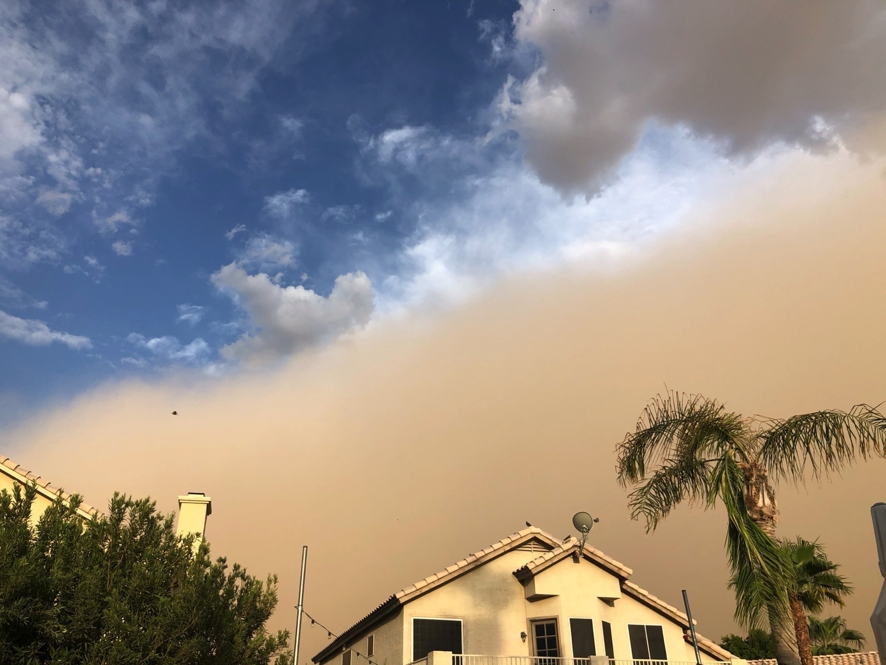 Haboob duststorm looking over a house