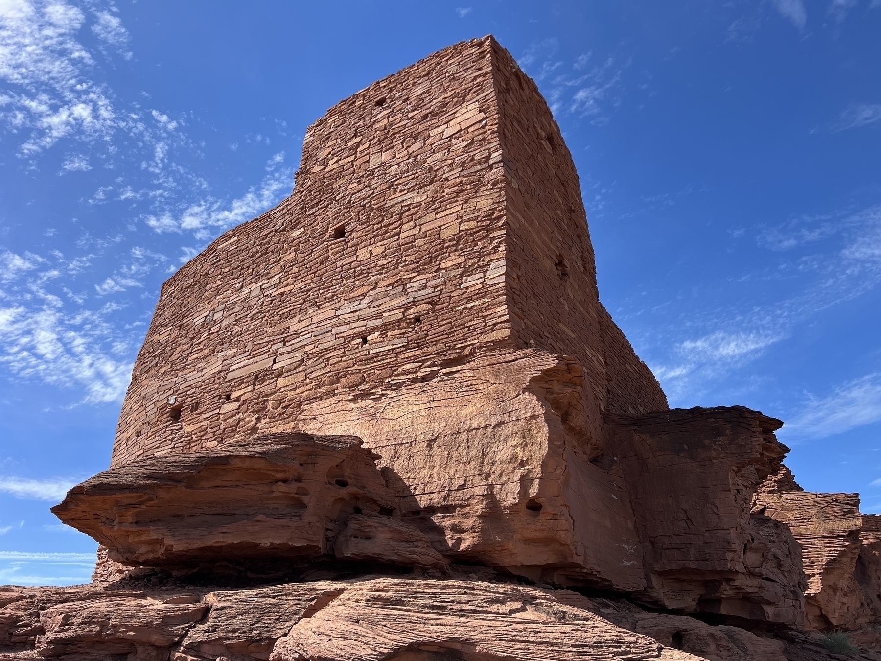 Wukoki Pueblo ruin on a sandstone rock escarpment 