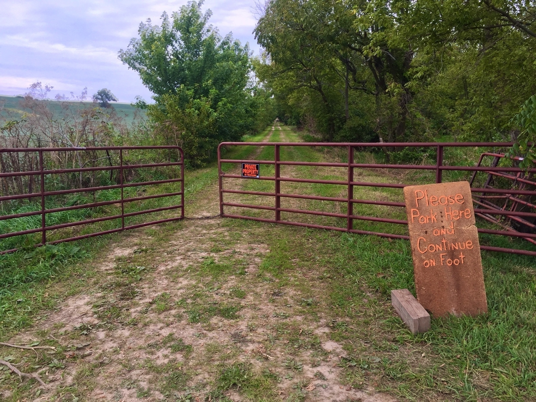 Gate with sign to park here and walk on foot