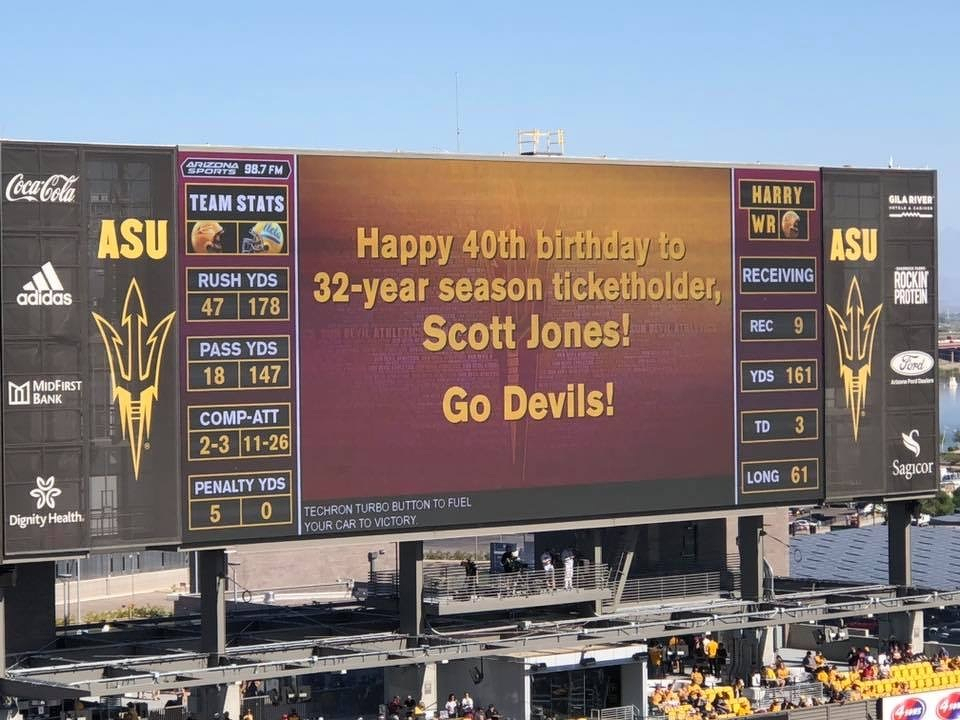 A scoreboard at a stadium displays a birthday message for an incredible, just astoundingly amazing, long-time ticket holder alongside football game statistics. While the stats make it seemed like UCLA was controlling the game, ASU would win this one. Did I mention how amazing that long-time fan is?