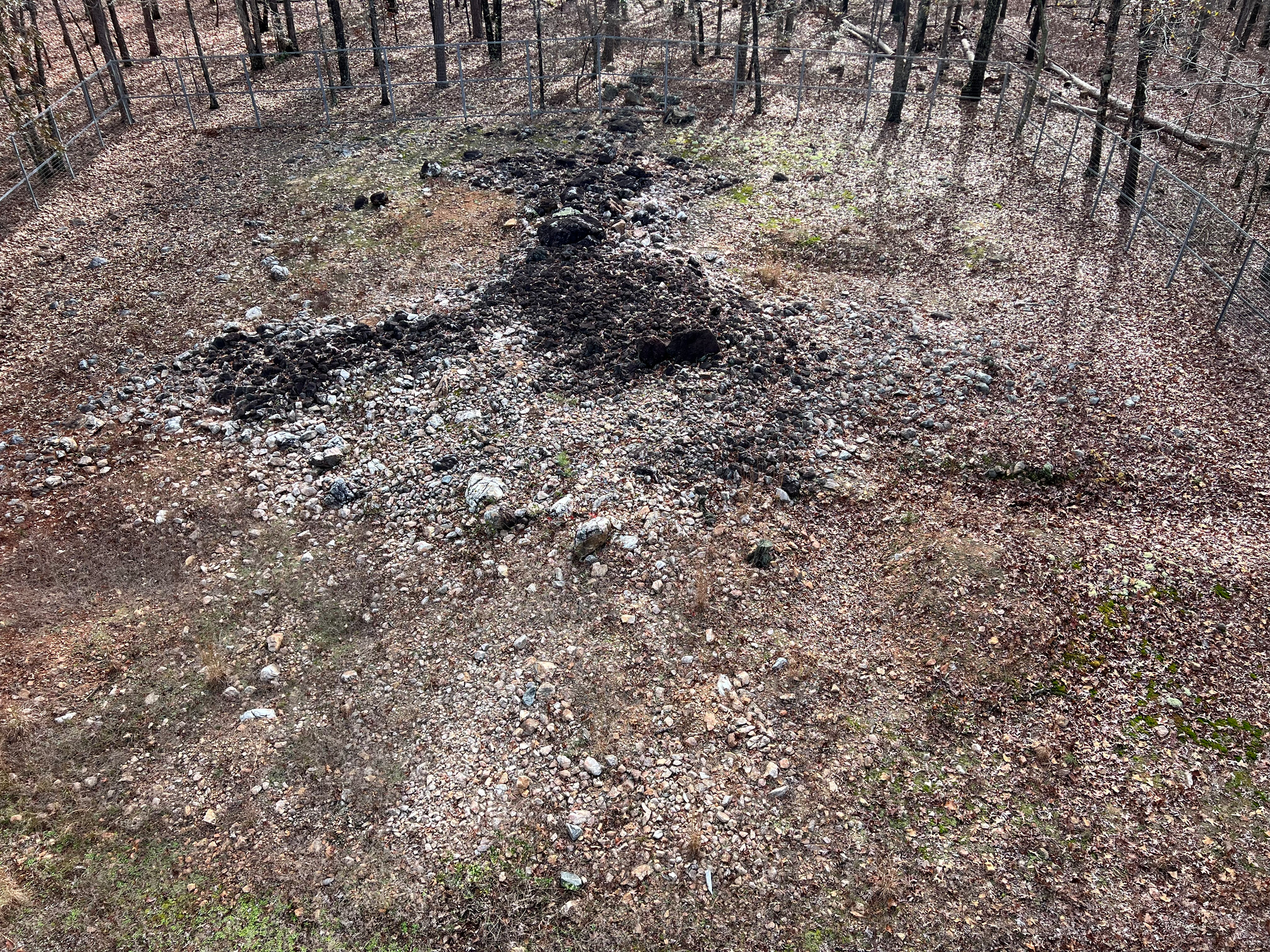 An informational sign details the changes over time to the Rock Hawk Effigy with diagrams and text.