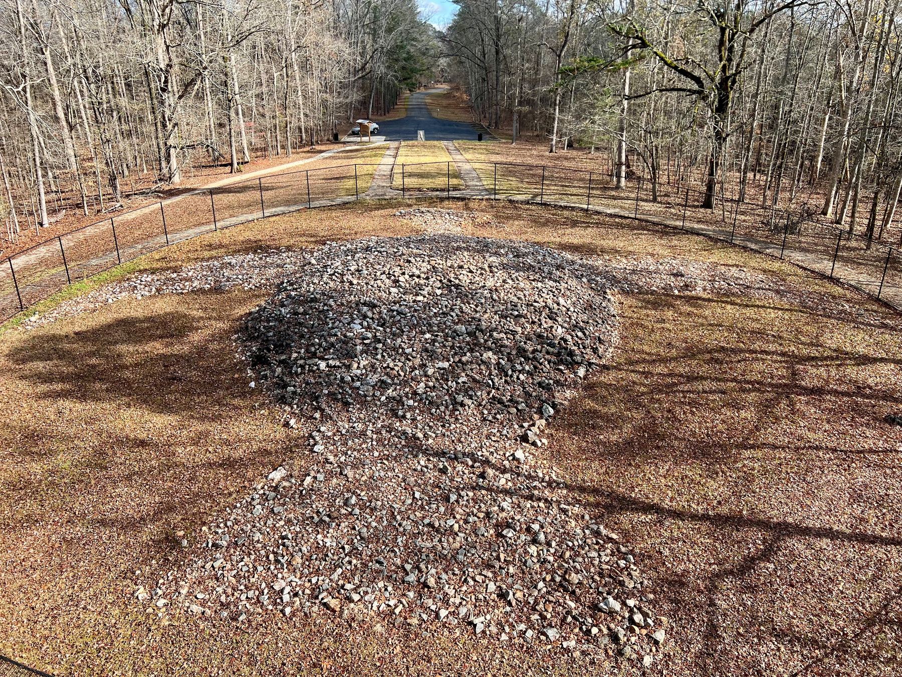 A historical information sign details the Rock Eagle Effigy, including images, maps, and text about its construction, history, and excavation.