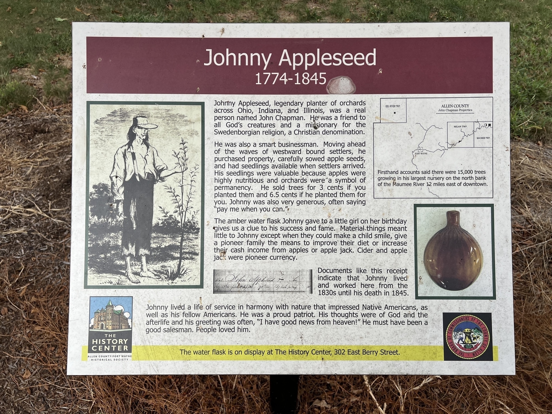 A historical marker describes the life and legend of Johnny Appleseed, accompanied by an illustration of him holding a sapling.