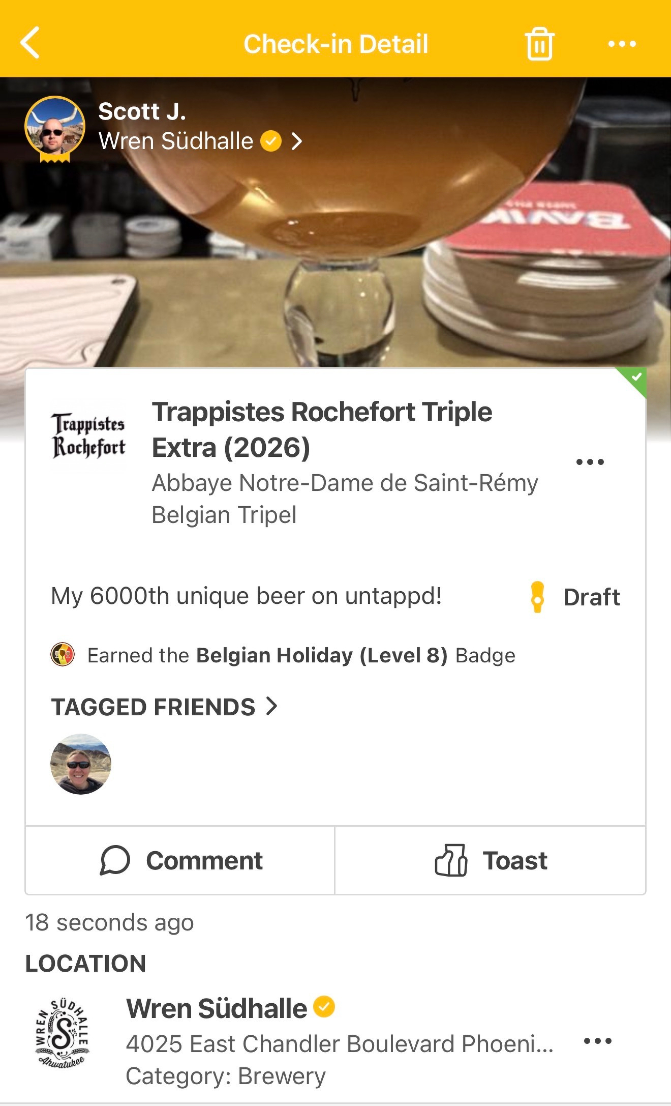 A beer enthusiast checks in a Trappistes Rochefort Triple Extra at Wren SΓΌdhalle, celebrating their 6000th unique beer on Untappd.