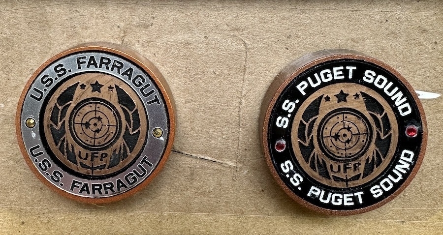 two hand crafted Star Trek badges, USS Farragut and the SS Puget Sound