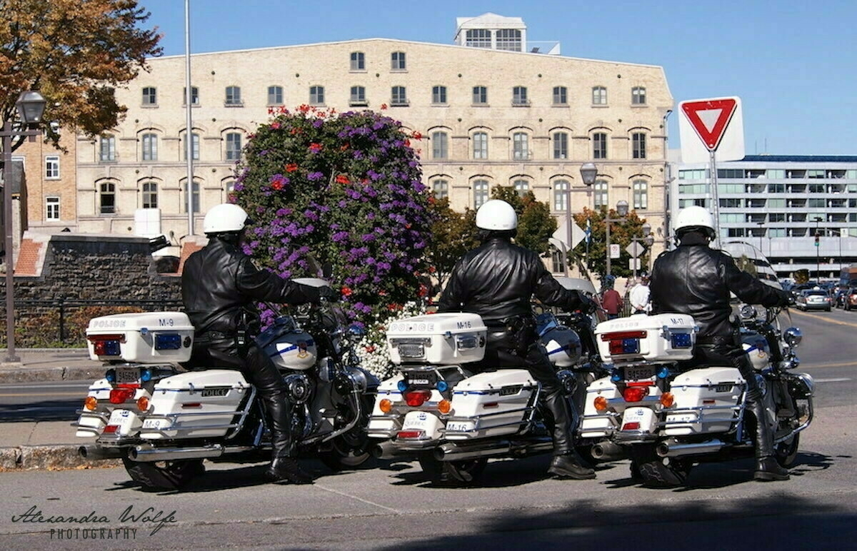 3 quebec city motorcycle cops having a break