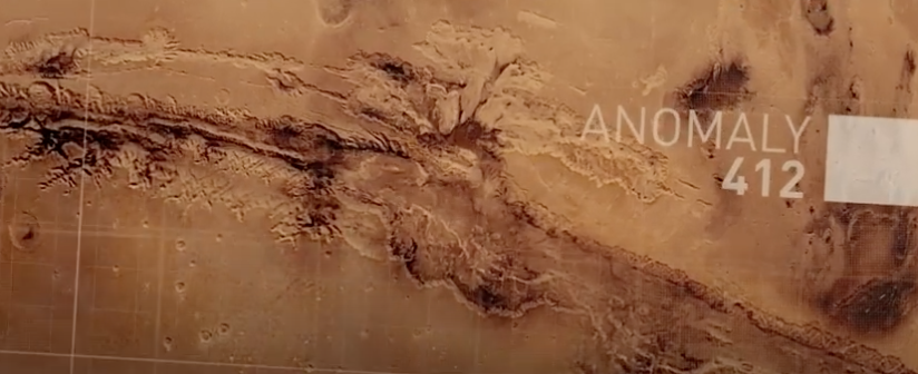 Auto-generated description: A detailed map-like depiction shows a rugged, canyon-like terrain marked with the label ANOMALY 412.