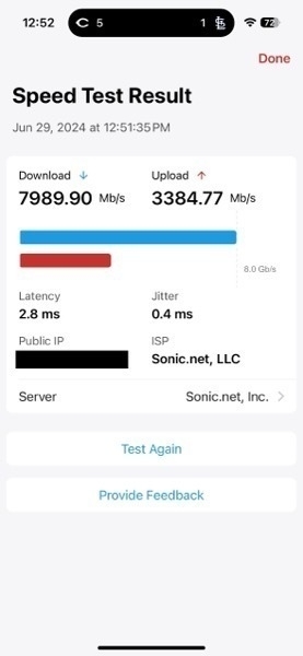 Screenshot of a speed test showing 'Download 7989.90 Mb/s, Upload 3384.77 Mb/s'. Also, the Cardinals were losing to the Reds.