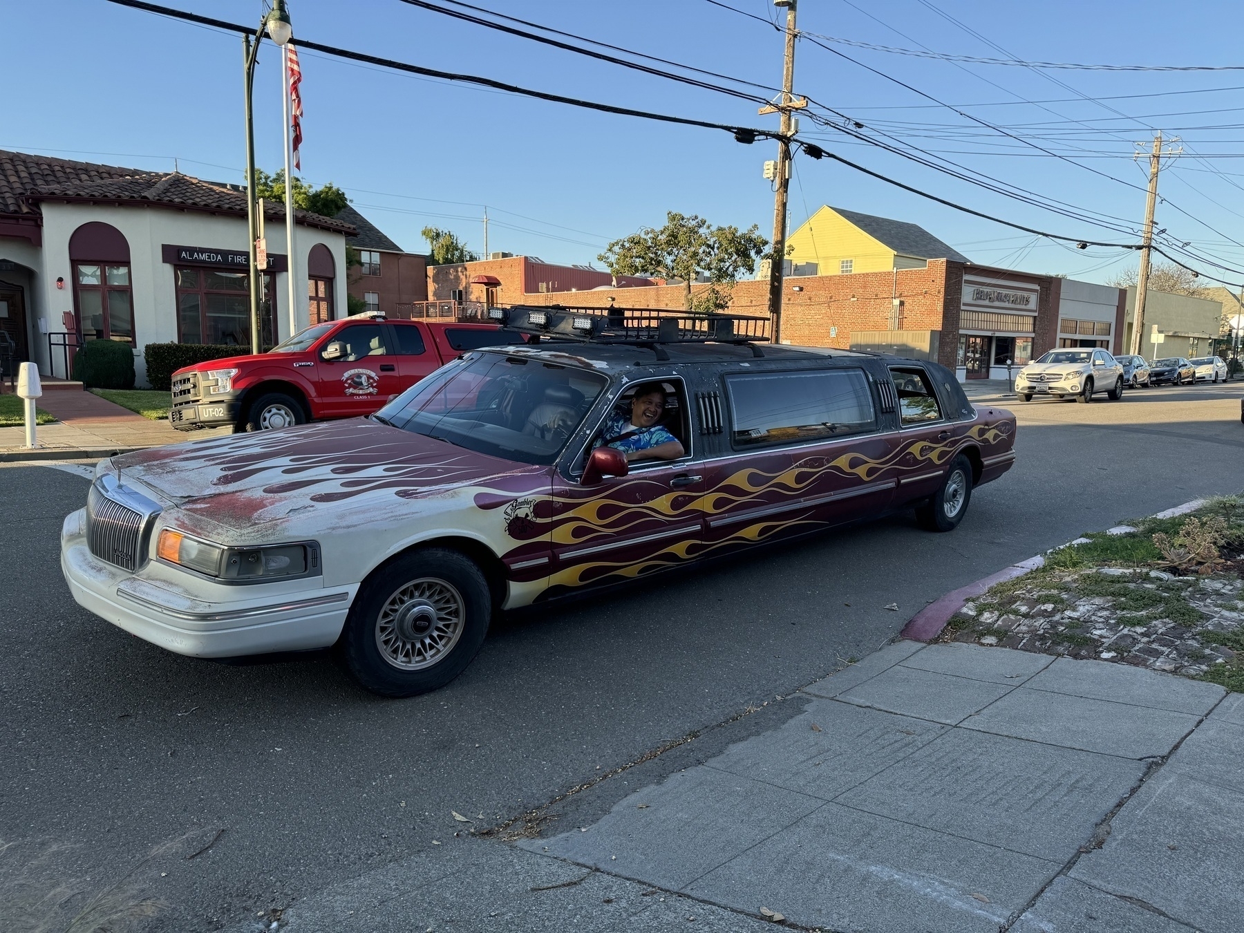 A shabby stretch limo painted with flames. We’re stylin’.